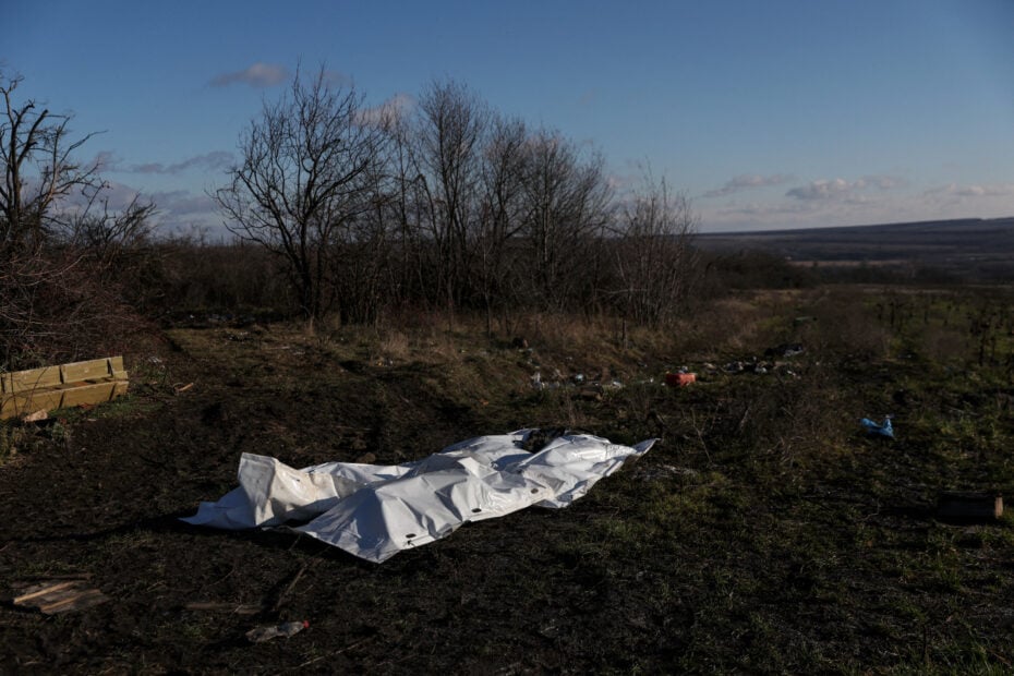 Bodies of dead Russian soldiers lay covered for the exchange of fallen Ukrainian soldiers remains in the former Russian occupied region of Donetsk Oblast region