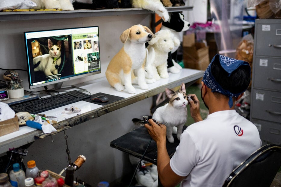 Workers make realistic pet plushies at the Pampanga Teddy Bear Factory, in Angeles City